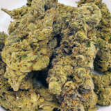Discover the allure of Georgia Pie, a delightful blend boasting a 60% indica dominance, born from the union of Gellati and Kush Mints strains. This exotic gem, primarily found in the heart of Colorado, captivates enthusiasts with its robust structure, tantalizing flavor profile, and potent effects. Dive into a world of sweet berry bursts complemented by rich cherry and nutty undertones. Its aroma dances with hints of earthy herbs, promising a sensory delight. Feel the magic of Georgia Pie as it takes you on a journey to pure bliss within minutes. Revel in the uplifting euphoria, tinged with a gentle haze, before a soothing sensation embraces your body. As the calm washes over you, don't be surprised if you find yourself with a hearty appetite. Given its impressive THC content of 25-27% and CBD levels of 1-3%, many turn to Georgia Pie to alleviate chronic stress, depression, appetite irregularities, and insomnia. Visually, this strain is a work of art. Behold the compact, popcorn-shaped green nugs, adorned with hues of purple, delicate amber strands, and a shimmer of frosty purple-tinged trichomes. Dive in and discover the magic of Georgia Pie!