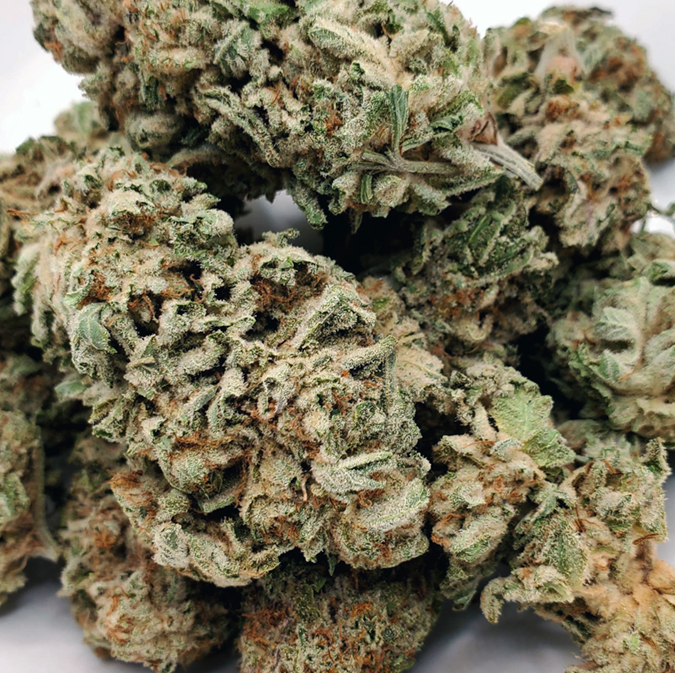 pink-fire.jpg Park Fire OG, an indica-dominant hybrid descending from OG Kush and SFG OG, boasts a striking appearance with forest-green leaves, purple tinges, fiery red pistils, and a silver kief coating. Contrary to its fiery look, it offers a sweet and skunky flavor with a citrusy, sour candy aroma. This strain has an intense THC content of 30-35%, leading to a potent high that starts with a euphoric head buzz and transitions into a deep body relaxation. Ideal for experienced users, it's effective for insomnia, anxiety, and stress, but beginners should approach with caution due to its powerful effects.